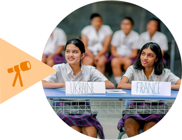 Students representing Ukraine and France at an international event at EKYA School Bangalore, demonstrating the global education approach of IGCSE schools in Bangalore